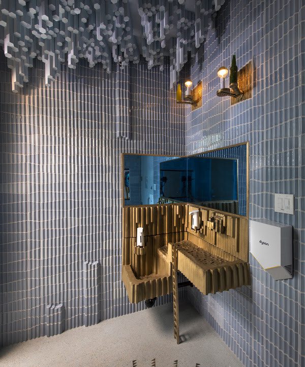 Detail of Joy Feasley and Paul Swenbeck's Listen, the Snow Is Falling washroom installation at the Art Preserve, 2021. Photo courtesy of John Michael Kohler Arts Center.