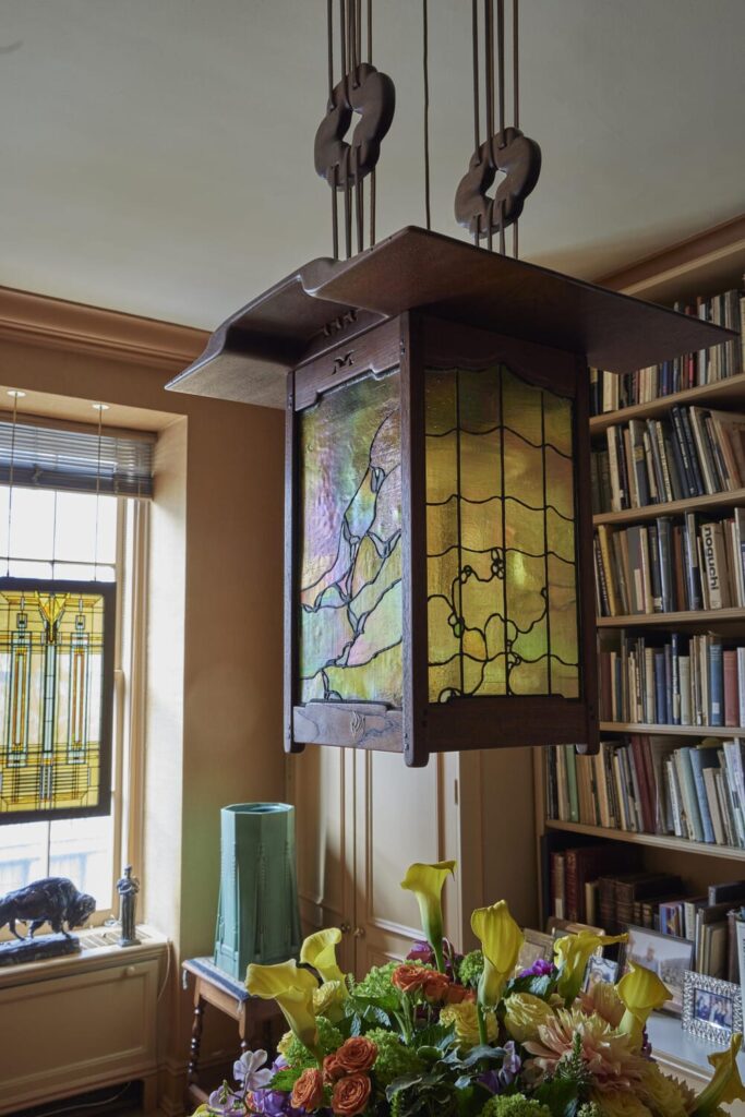 Greene & Greene  Monumental Lantern from the Entry of the Robert R. Blacker House, Pasadena, California  Circa 1908  Iridized and opalescent glass, mahogany, ebony, abalone, copper, fruitwood and silver inlays  23 in. (58.4 cm) drop 